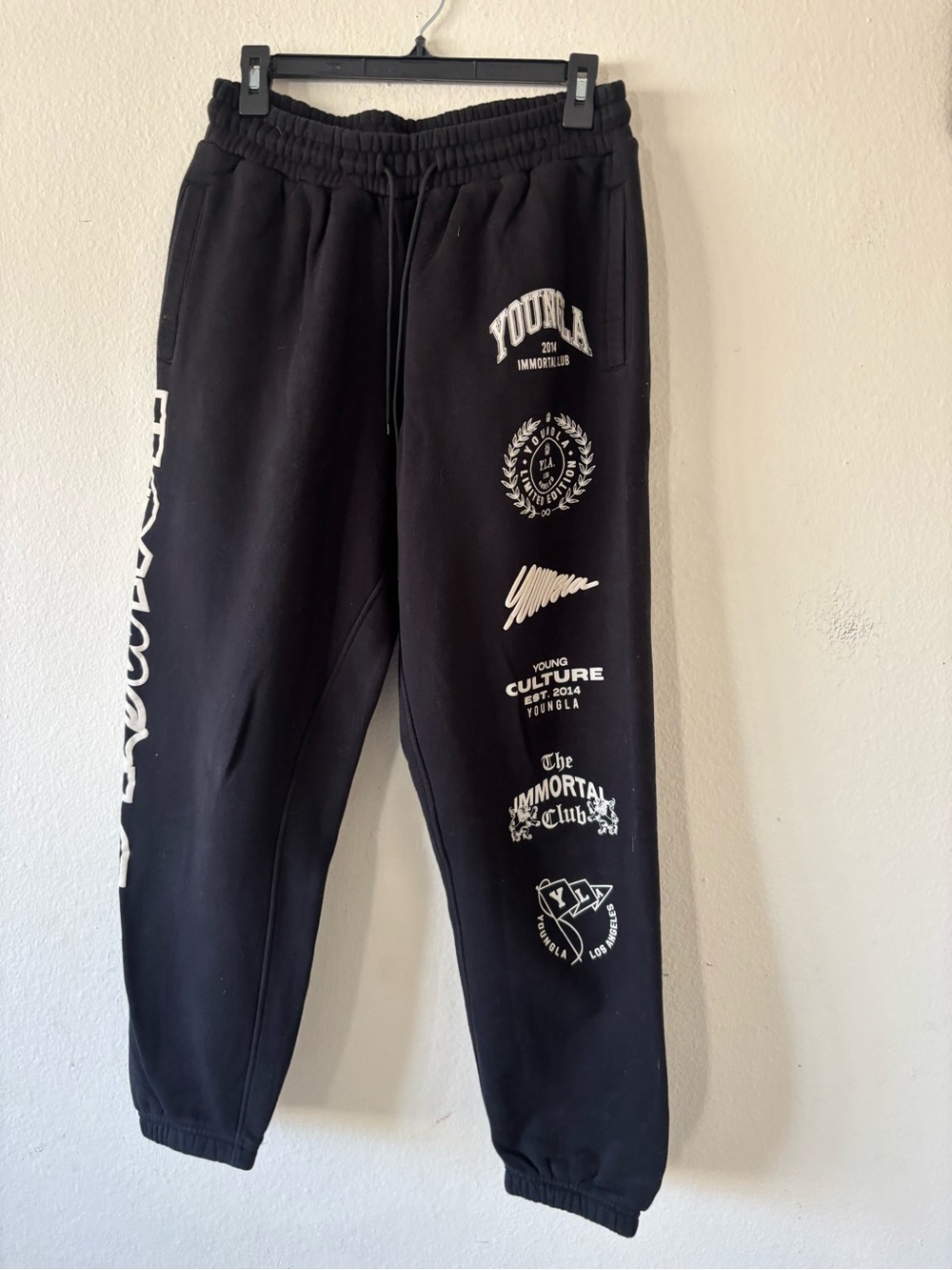 Men's Fall YoungLA black sweatpants with white text and logos
